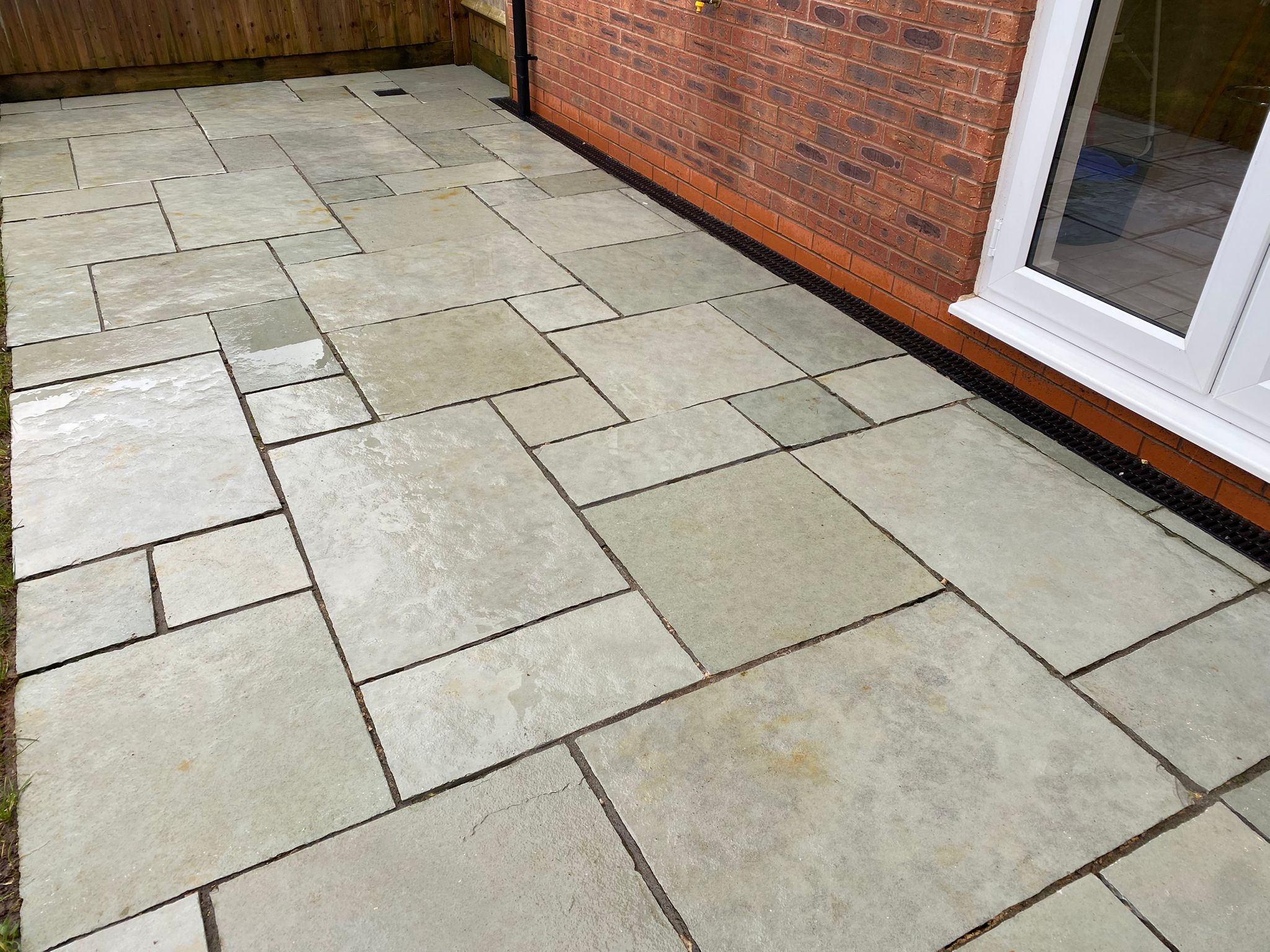 Natural stone patio cleared of moss, stains and footprints – after cleaning