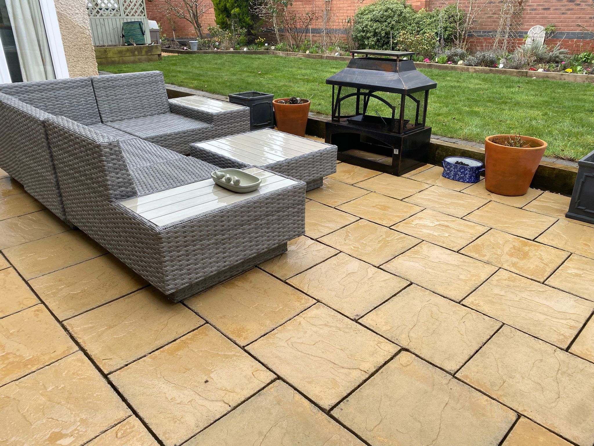 Garden patio deep cleaned — algae, leaves and grime removed – after cleaning